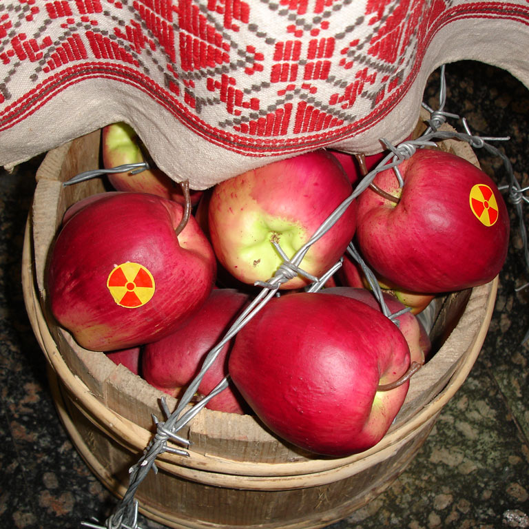 A basket of apples lying on the floor