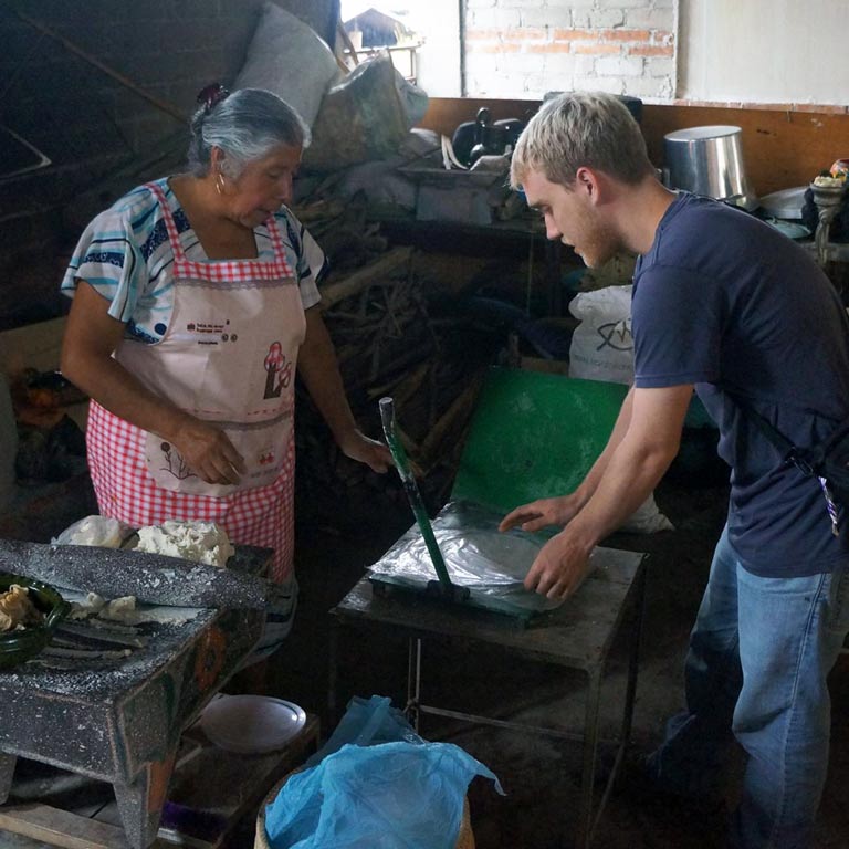 A woman and a young man talking to each other